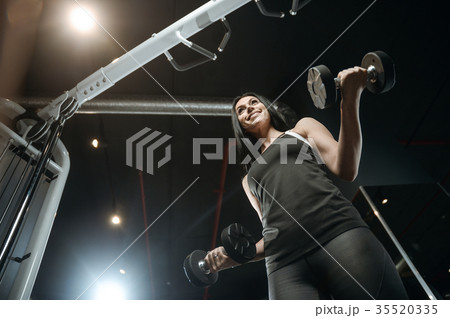 Sexy athletic young girl working out in gym Sexy athletic young girl working out in gym 35520335