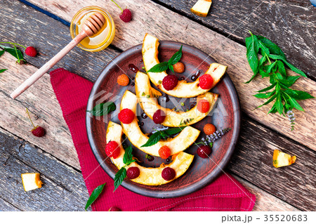Grilled pumpkin with honey, raspberry and mint Grilled pumpkin with honey, raspberry and mint 35520683