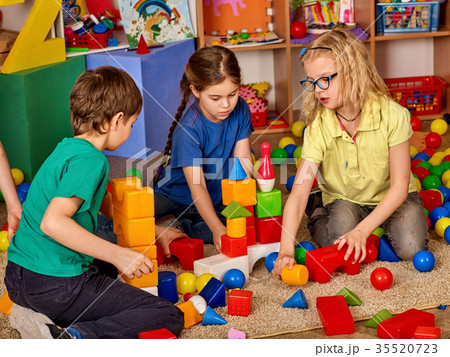 Children building blocks in kindergarten. Group 35520723