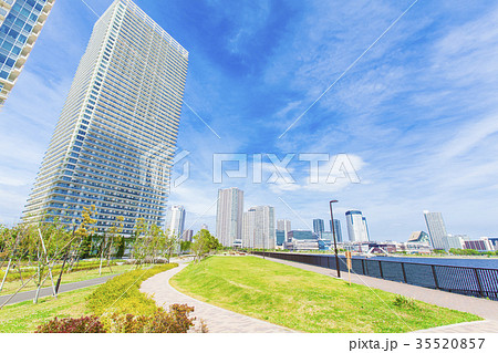 川沿いのタワーマンションと青空の写真素材