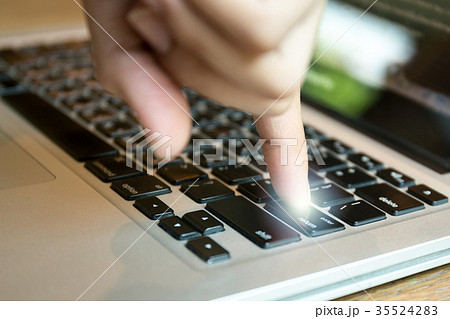 Conceptual finger put the enter button on keyboard 35524283