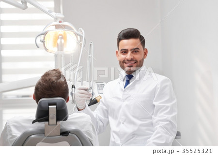 Professional dentist at his clinic 35525321