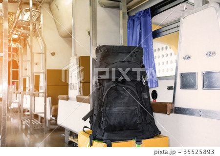 Black luggage on a chair 35525893