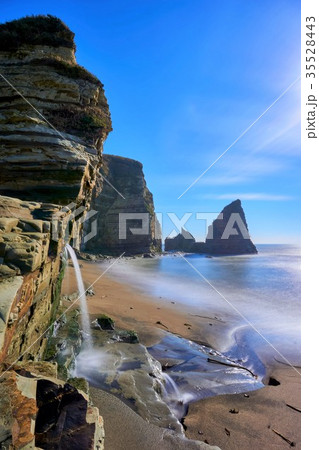 千葉県 大波月海岸 ロウソク岩と滝の写真素材