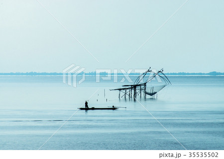 Minimal image of fisherman in the lake 35535502