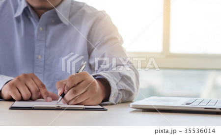 Businessman working reading documents  35536014