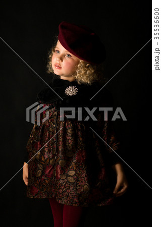 Pretty girl in brown old-fashioned costume 35536600