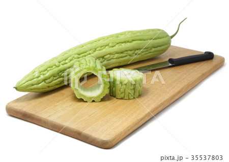 Bitter melon ​​on wooden cutting boards. 35537803