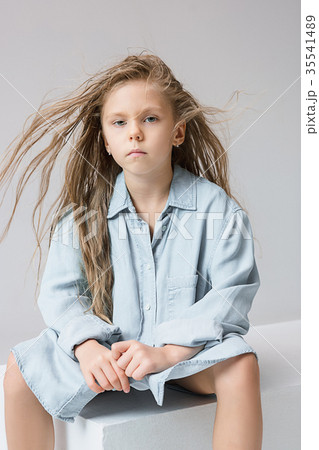 Stylish young teen girl over gray background 35541489