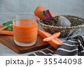 Glass of Fresh Carrot Juice on wooden board 35544098
