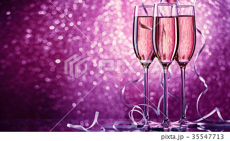 Picture of three wine glasses with sparkling 35547713