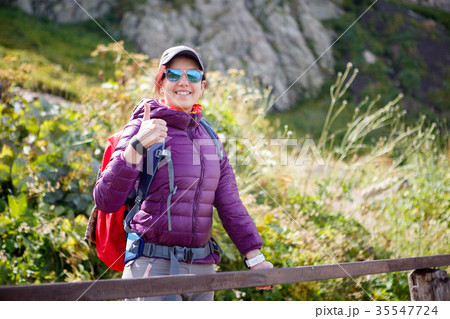 Female tourist in sunglasses against of 35547724