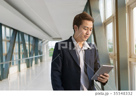 Businessman using a smartphone 35548332