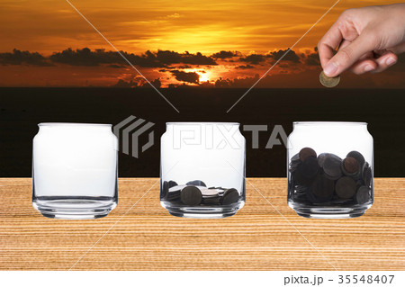 saving money in jar saving money in jar 35548407