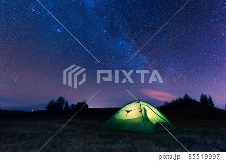 Green tent lighted from the inside 35549997