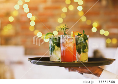 Two cocktail glasses on tray in the bar Two cocktail glasses on tray in the bar 35551560