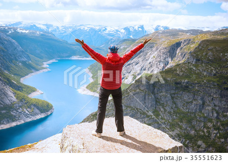 Sporty woman posing on Trolltunga Norway 35551623