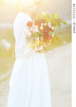 Beautiful bride with wedding bouquet Beautiful bride with wedding bouquet 35552148