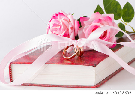 Wedding concept with rings and roses Wedding concept with rings and roses 35552858