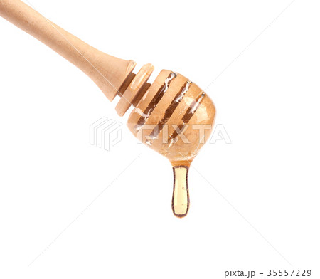 Isolated honey. Dripping honey on wooden stick Isolated honey. Dripping honey on wooden stick 35557229