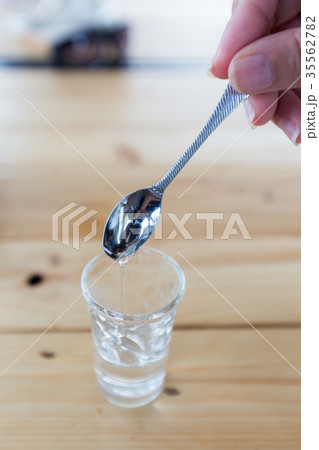 syrup in glass bottle 35562782