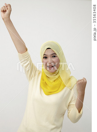 celebrating with arm raised 35563408