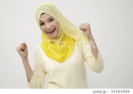 celebrating with arm raised 35563409