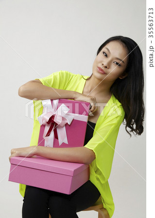 chinese woman with present 35563713