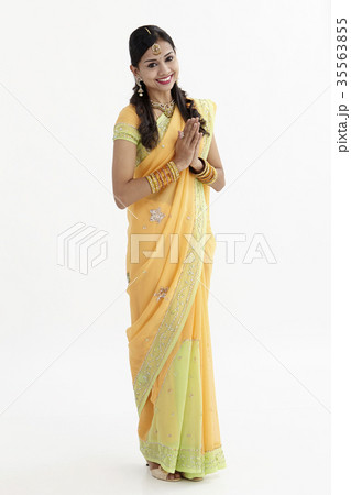 Woman greeting in mekhla 35563855