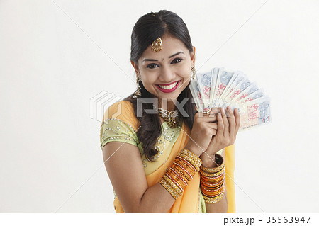 indian woman holing cash 35563947