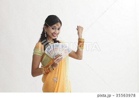 indian woman holing cash 35563978