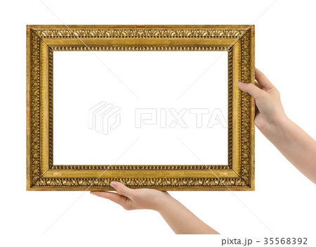 Wooden picture frame in hands 35568392