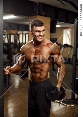 Young Bodybuilder Doing Exercise For Biceps Young Bodybuilder Doing Exercise For Biceps 35568880