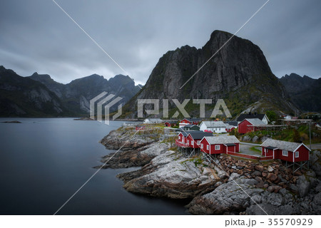 Traditional red rorbu cottages in Hamnoy village Traditional red rorbu cottages in Hamnoy village 35570929