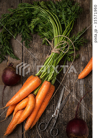 Red carrot on wooden background table. Top view  35571960