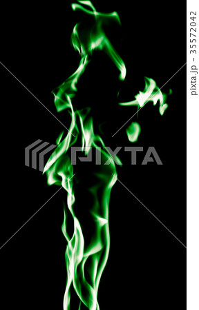 Green flame of fire on a black background Green flame of fire on a black background 35572042
