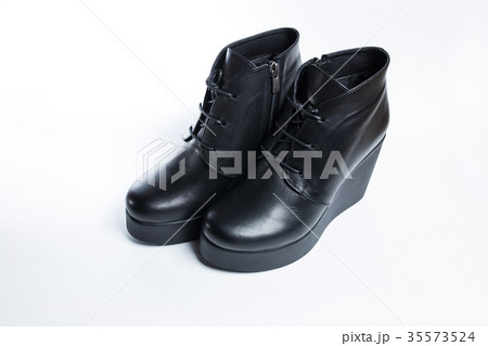 Female black boots isolated on a white background. 35573524
