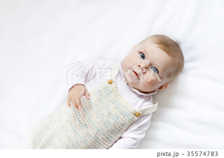 Portrait of cute baby girl wearing vintage clothes Portrait of cute baby girl wearing vintage clothes 35574783