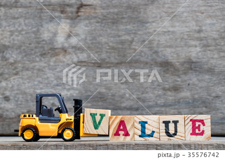 Yellow forklift hold letter V to complete value Yellow forklift hold letter V to complete value 35576742