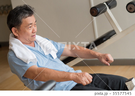strong healthy happy asian man working out in gym 35577545