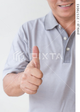 middle aged old man showing thumb up middle aged old man showing thumb up 35579643