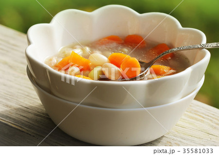 Vegetable soup with bean and carrots on green 35581033