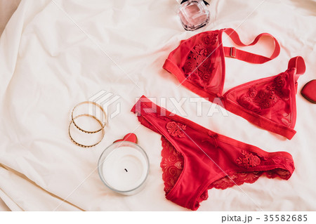 Women`s Lingerie on White Bed Sheet. Many Different Lace Bikini Panties and  Black Beads Stock Image - Image of desire, flatlay: 194482719