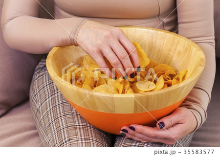 woman with chips woman with chips 35583577