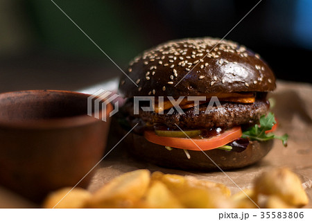Black double hamburger made from beef, cheese and 35583806