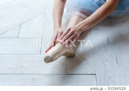 young ballet-dancer sitting on the floor young ballet-dancer sitting on the floor 35584528