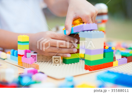 Asian child girl hand playing with colorful blocks 35588011