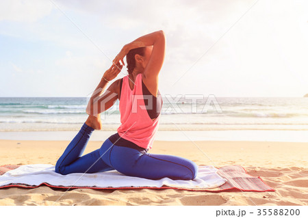 Woman playing Yoga and exercise on the tropical beach in Thailand 35588200