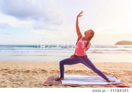 Woman playing Yoga and exercise on the tropical beach in Thailand 35588385
