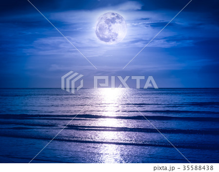 Colorful sky with dark cloud and bright full moon Colorful sky with dark cloud and bright full moon 35588438